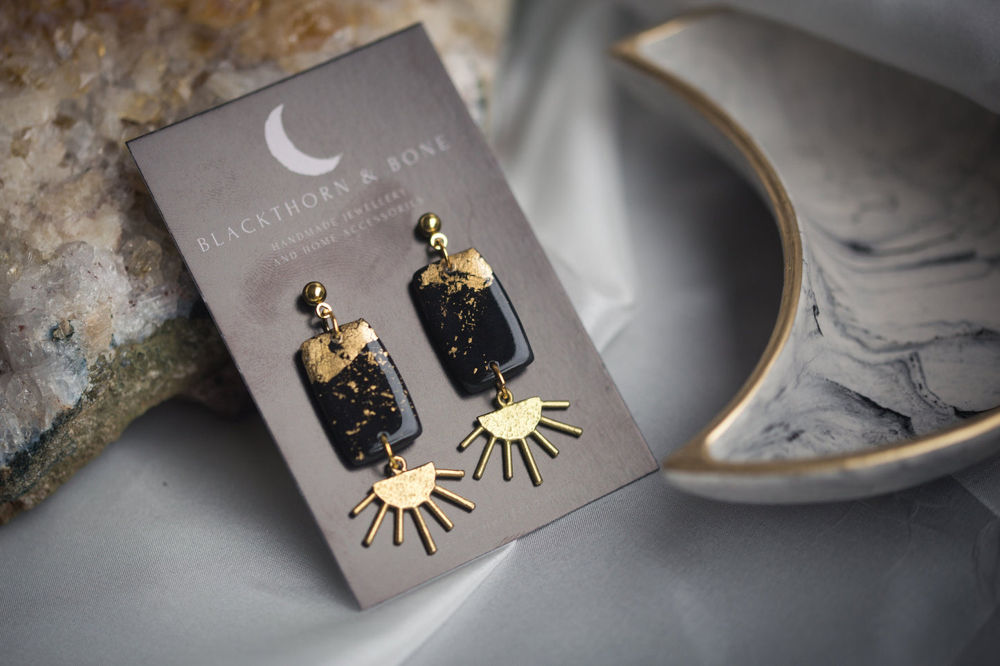Black and Gold Clay Earrings with Brass Sun Charm