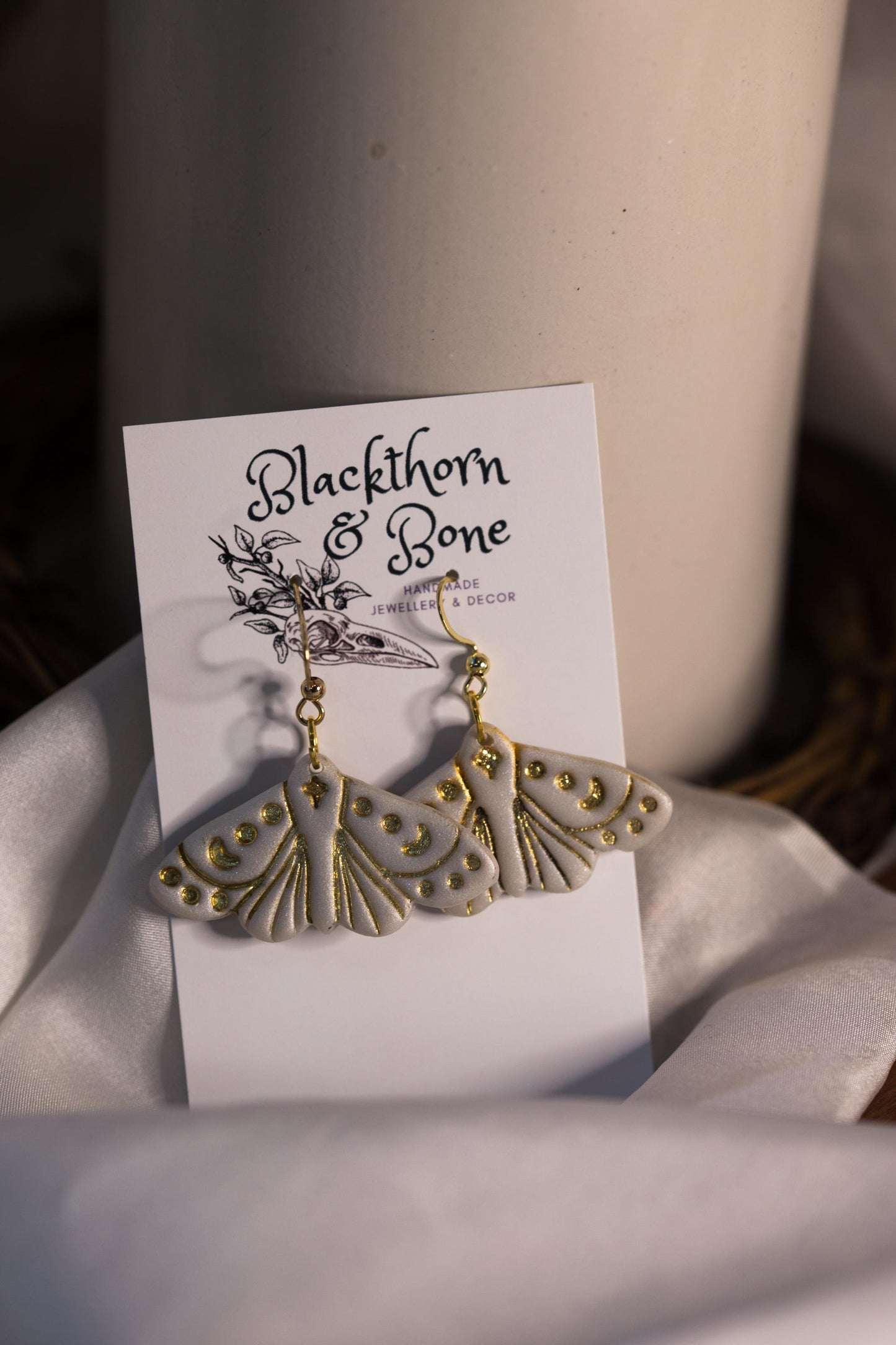 Pearlescent White Moth Embossed Statement Earrings